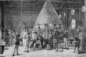 Eine Schwarz-Weiß-Zeichnung einer Gruppe von Menschen, die in einer 19. Jahrhundert-Fabrik arbeiten, wobei einige Werkzeuge halten und verschiedene Gegenstände herumliegen, und Text am unteren Rand, der "19. Jahrhundert Schmiede" liest.